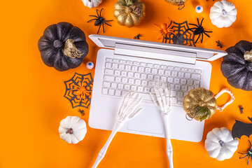 Funny Halloween workplace with laptop flat lay. Office corporation Halloween party invitation,...