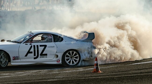 Toyota Supra drifting on a dust during the event in Budapest, Hungary