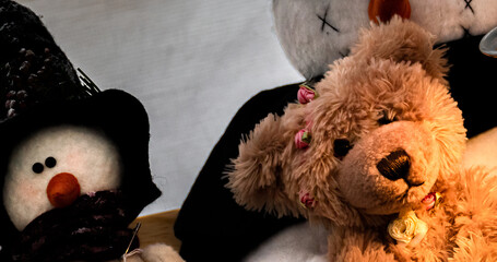 A handmade Teddybear and snowman on a shelf for sale at a local apple festival in Upstate NY. ...