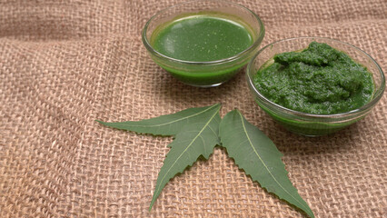 Neem leaves used as ayurvedic medicine with ground neem paste and juice Used in skin care, beauty products and creams.