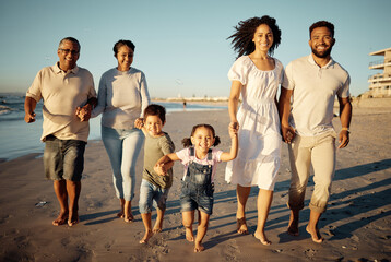 Portrait of happy family with little kids walking together on beach during sunset. Adorable little...