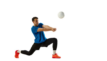 Studio shot of young man, volleyball player playing volleyball isolated on white studio background. Sport, gym, team sport, challenges