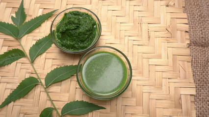 Neem leaves used as ayurvedic medicine with ground neem paste and juice Used in skin care, beauty products and creams.