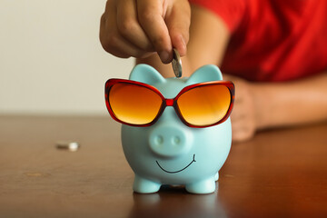 Piggy bank, sunglasses, travel money.