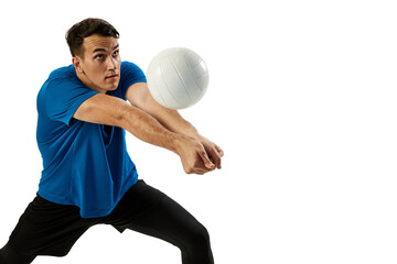 Closeup of young man, volleyball player playing volleyball isolated on white studio background....