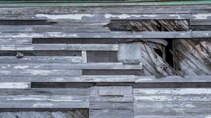 Closeup of broken wooden planks on the exterior of the Bering Hill Chapel on Adak Island