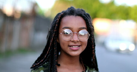 Hispanic black girl child wearing glasses portrait face close-up