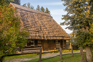 Fototapeta na wymiar Traditional rural authentic Ukrainian wooden country house in Carpathians (museum restoration)