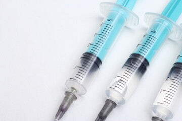 Medical syringe on a white background. A syringe for injection. The concept of health and beauty