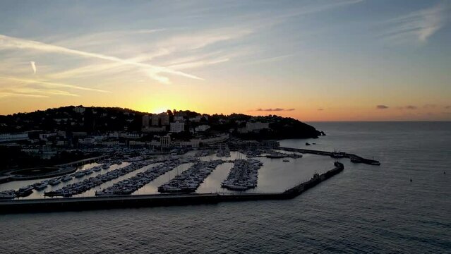 4k video as the sun rises over the resort of Torquay in Devon, UK