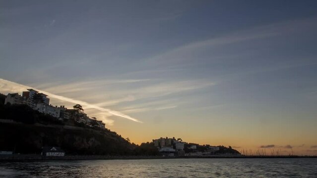4k timelapse of sunset over the resort of Torquay in Devon, UK