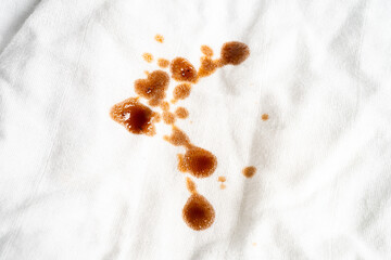 Dirty sauce stain on cloth to wash with washing powder, cleaning housework concept.