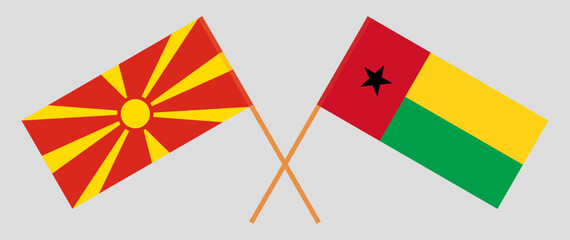 Crossed flags of North Macedonia and Guinea-Bissau. Official colors. Correct proportion