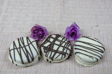 Delicious white chocolate alfajor with sweet milk on the table