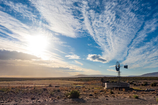Image Number ZV1452054. Windmill (windpump) in a Roggeveld rural scene showing beautiful cloud formations. Near Sutherland, Northern Cape. South Africa.