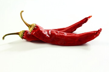 dry organic kashmiri red chili pepper well known for dark red color food recepi in indian gujarati food isolated on white background,selective focus - obrazy, fototapety, plakaty