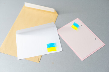 Ukraine flag on craft envelope letter. National invitation concept. Invitation for education theme.