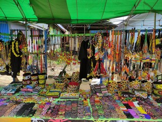 a shop selling a variety of traditional Dayak Kenyah handicraft accessories