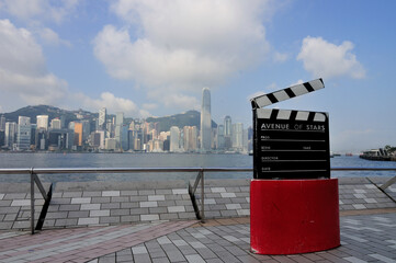 Film Clapboard Monument At Avenue Of Stars with background skyline view of business district In...