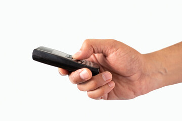 In the hands of an old model of a mobile phone against white background