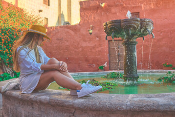 Young Tourists Exploring in the fountain the Santa Catalina Monastery, Convento de Santa Catalina,...