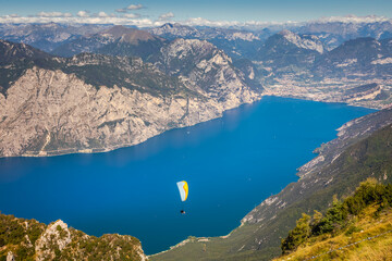 Paragliding above idyllic Lake Garda from Monte Baldo, Malcesine, Italy