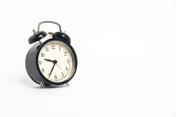 black vintage alarm clock isolated on white background, Time concept, 9:35 o'clock. Morning, reminder.