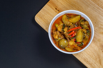 Top view of Thai beef red curry, Thailand tradition red soup with beef and coconut milk, Panaeng Curry in white plate, Thai curry, Thai food, Beef Recipe.