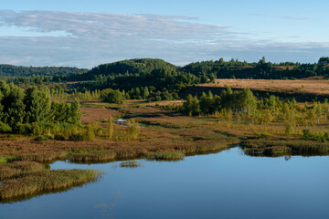 Fototapeta na wymiar View of the Izborsko-Malskaya Valley and Gorodishchenskoe Lake on a sunny summer day, Izborsk, Pechersk district, Pskov region, Russia