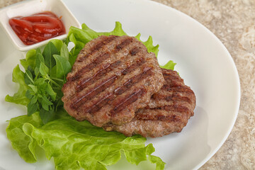 Grilled beef burger cutlet with sauce