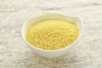 Raw couscous in the bowl