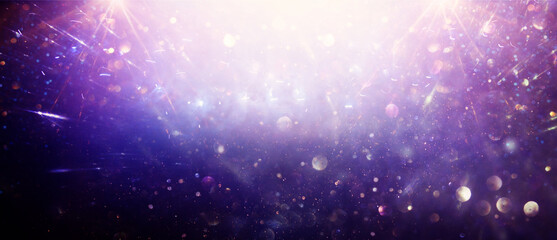 background of abstract blue, pink, purple and gold glitter lights. defocused