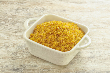 Raw bulgur in the bowl