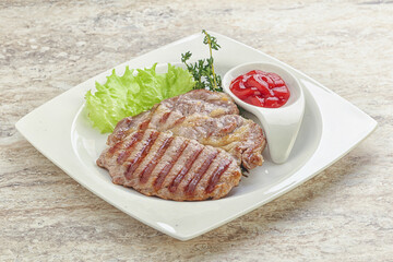 Grilled pork neck steak with ketchup