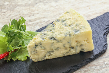 Blue cheese piece over board