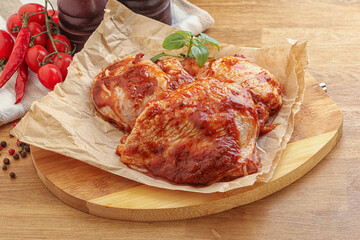 Marinated chicken leg in tomato sauce