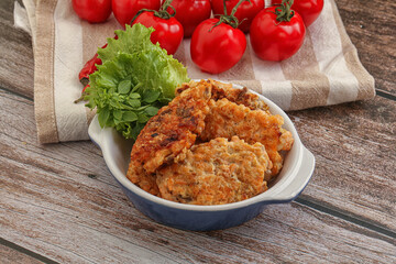Fried salmonn cutlet in the bowl