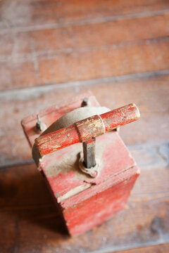 Dynamite Detonator, red box and a metal handle, a plunger to detonate dynamite in quarrying.
