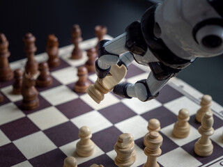 A man plays chess with a robot.
