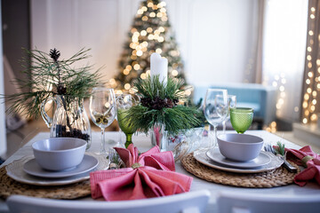 New Year's Christmas table, setting for a festive dinner. Home interior.