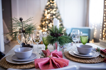 New Year's Christmas table, setting for a festive dinner. Home interior.