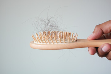 man hold his list hair close up 