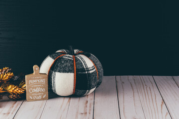 Plaid black and white orange pumpkin with a coffee and fall plaque still life for autumn projects