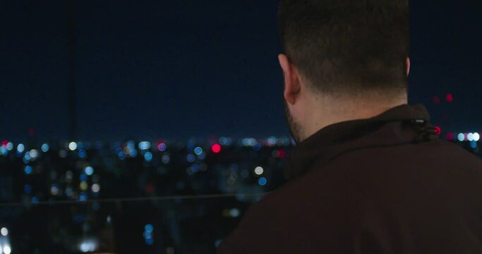 MAN WATCHING NIGHT CITY
