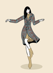 Young stylish woman in a coat dancing and posing.