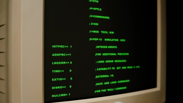 Retro pc with loading code console, programmer making scripts, green basic screen, Old computer studio close-up, Desktop vintage retro wave display, late 90s PC.