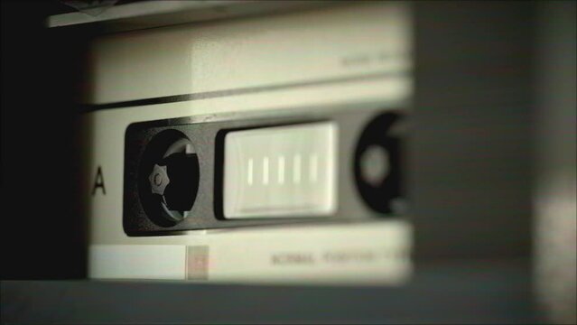 Retro radio tape recorder, audio cassette close-up. Listening to music, old radio boombox player, searching channel. 