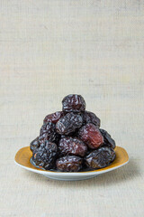 Delicious ajwa dates ( kurma nabi ), Much sought after during the month of Ramadan as a dish for breaking the fast, ramadhan kareem, empty space, copy space.