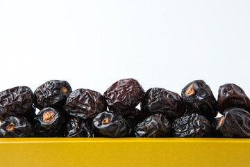 Delicious ajwa dates ( kurma nabi ), Much sought after during the month of Ramadan as a dish for breaking the fast, ramadhan kareem, empty space, copy space.