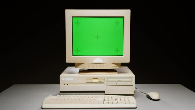 Retro pc with chroma key green screen, Old computer studio close-up, Desktop vintage retro wave display, late 90s PC mock up for 3d motion design and advertising. 